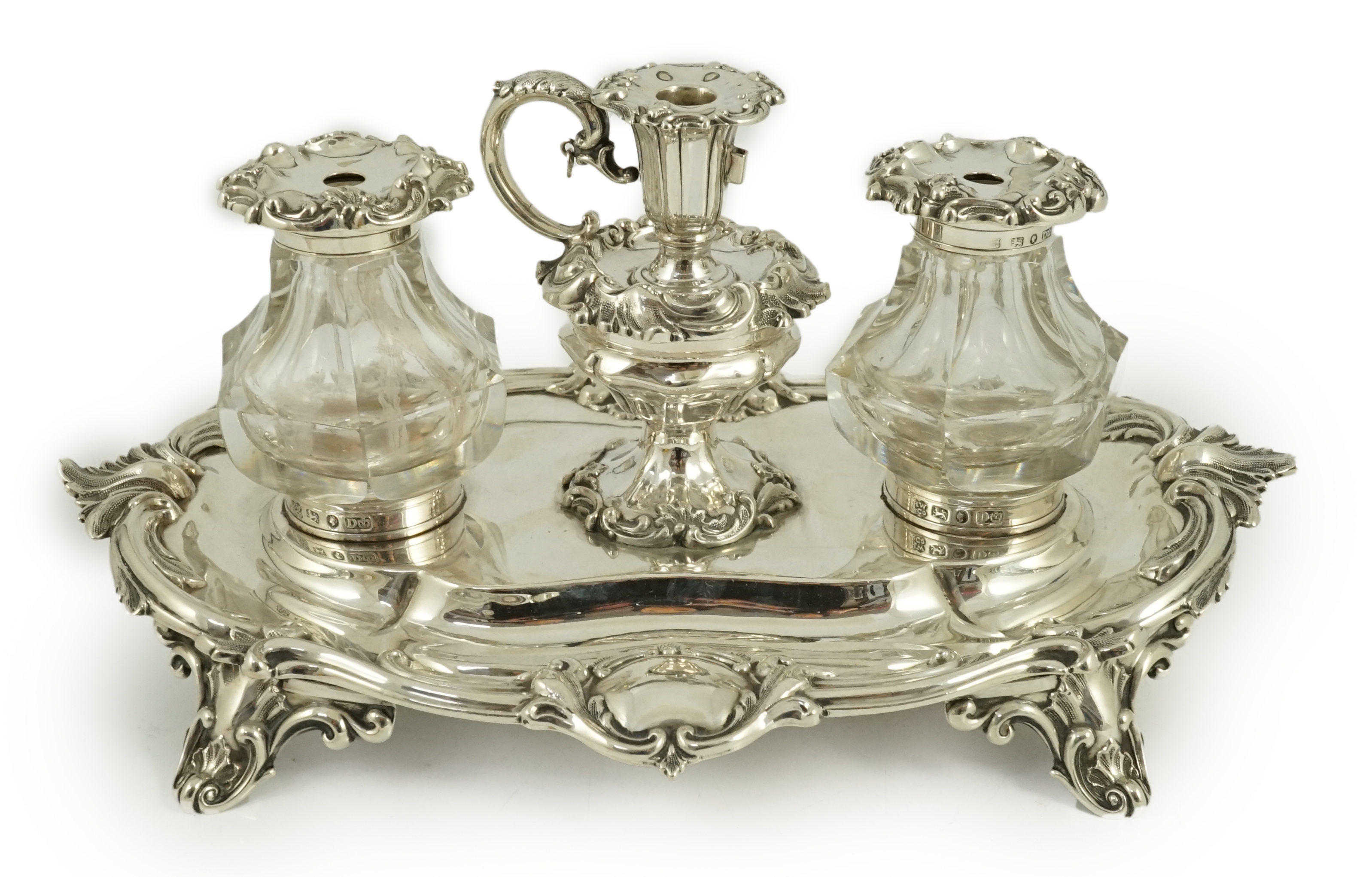 An ornate Victorian silver oval inkstand, by Henry Wilkinson & Co